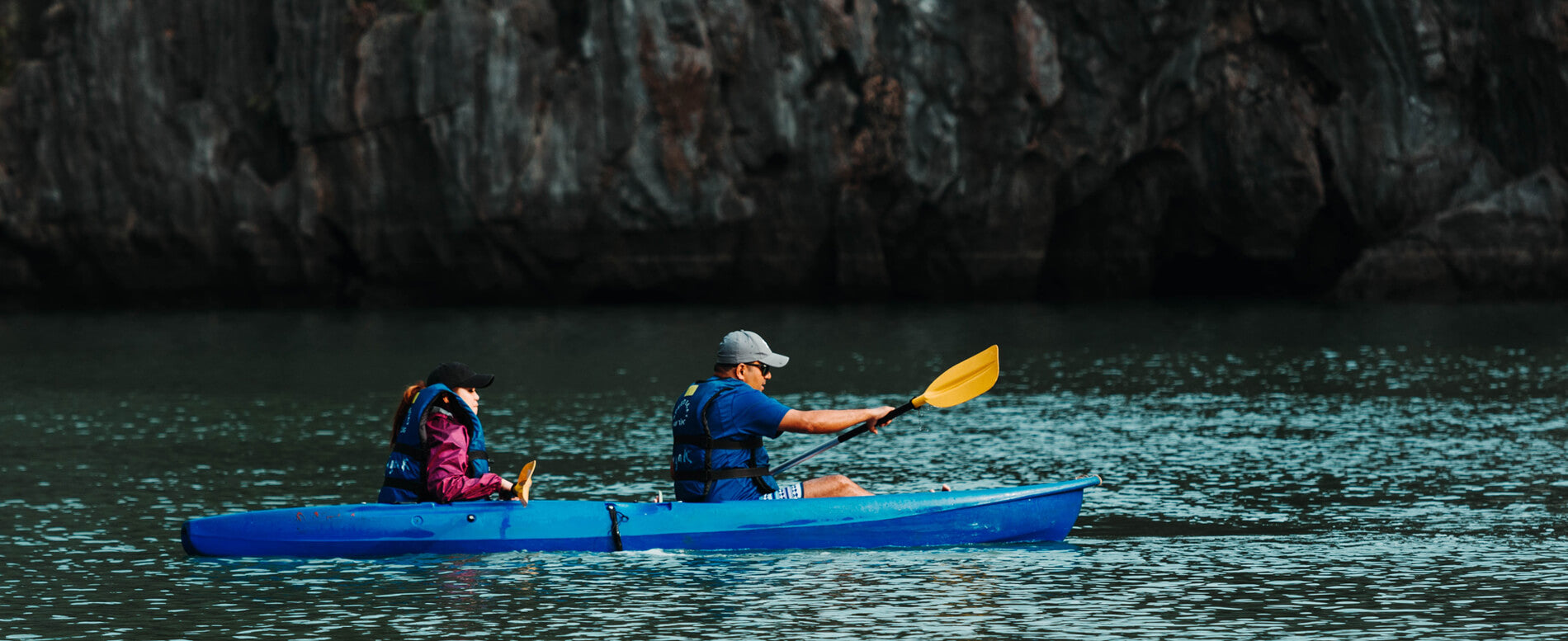 Man and a woman on a blue best tandem kayak