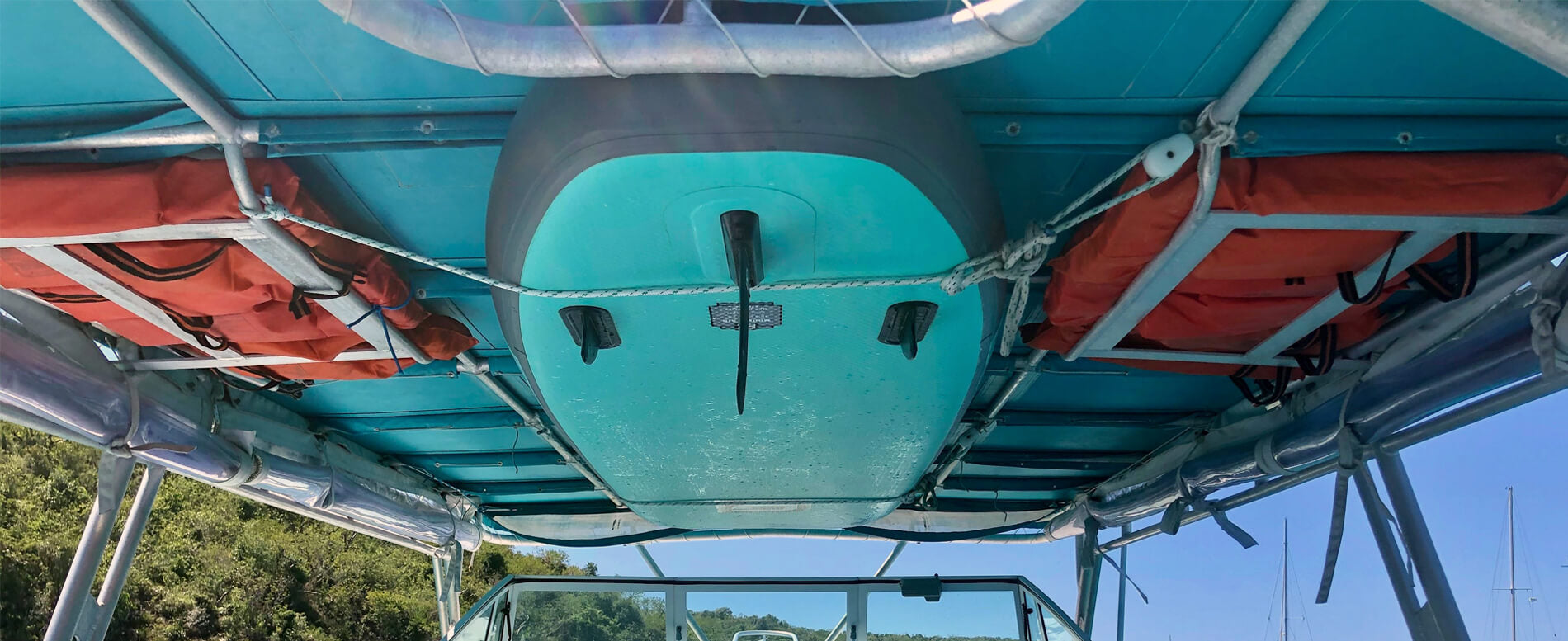 GILI paddle board attached on a boat ceiling using a rack
