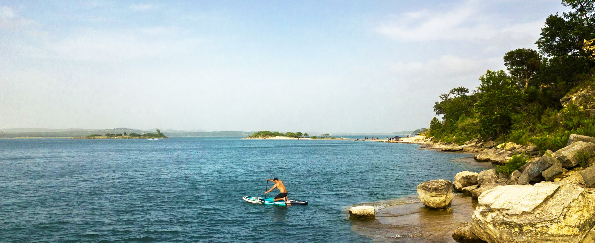 Man paddle boarding on the ocean