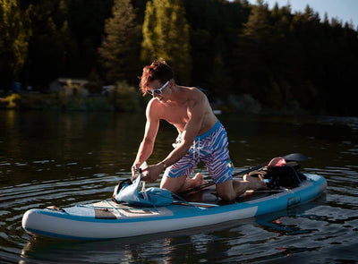11' Adventure Inflatable Paddle Board on the water
